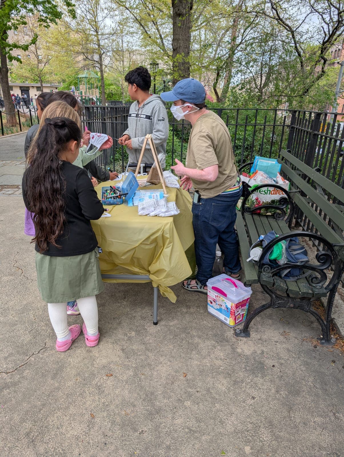 Washington Heights-Inwood Mask Bloc founder Evan Sachs leads local kids in decorating mask covers.
