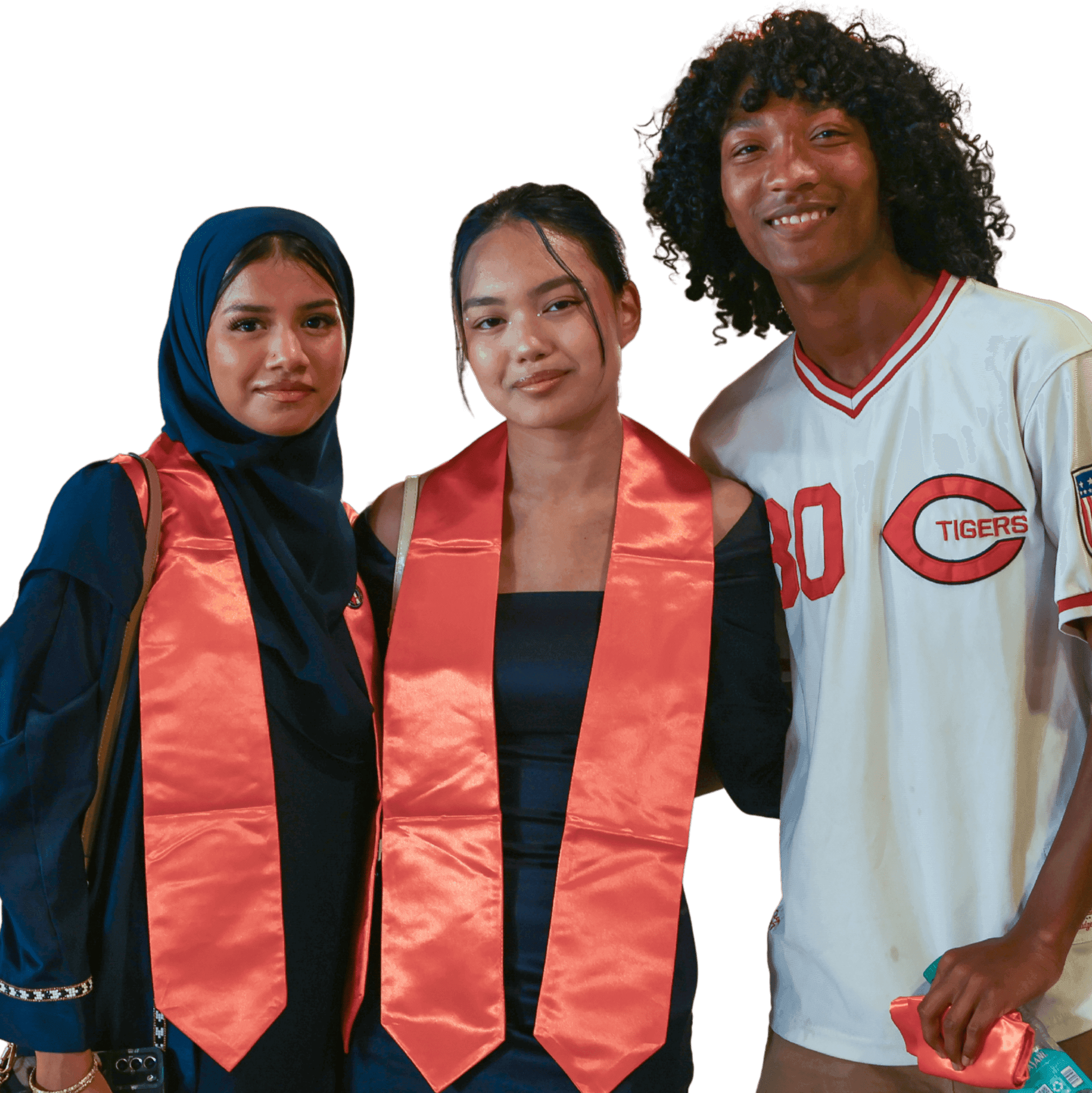 Smiling students smile and pose for graduation photo. 