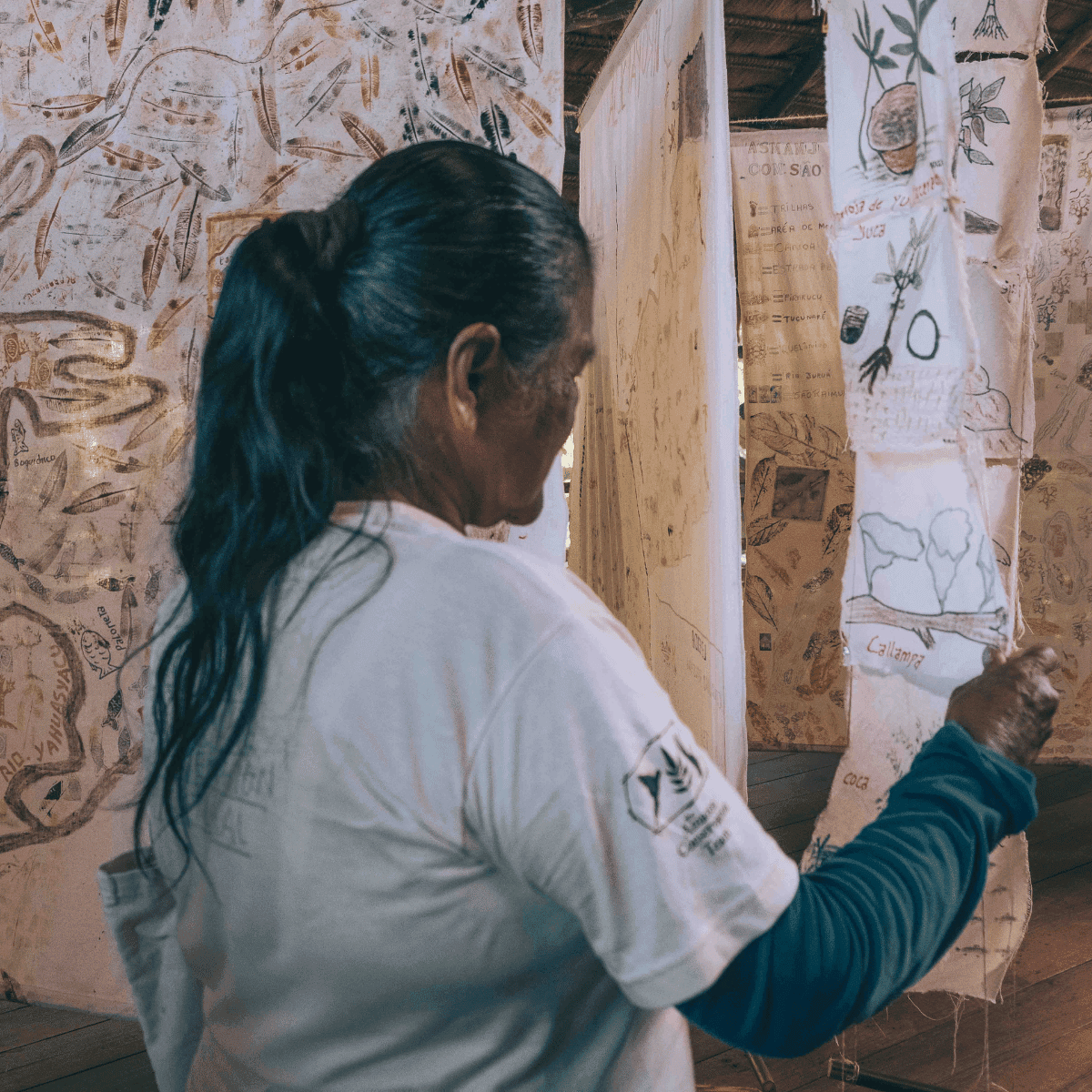 Woman looking at maps that show food of her region